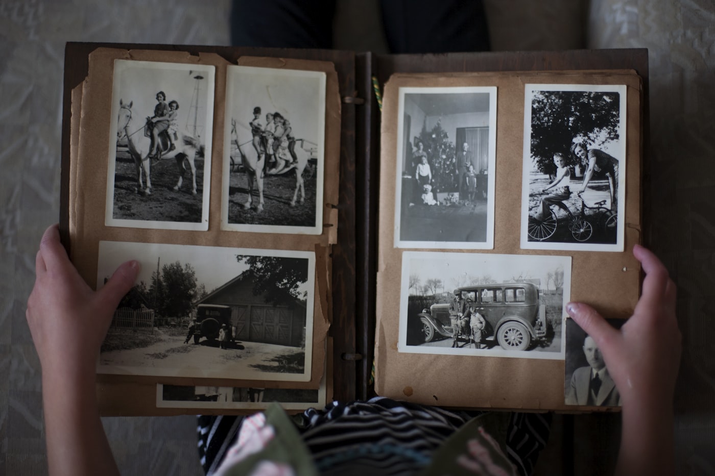 An old family photo album being leafed through