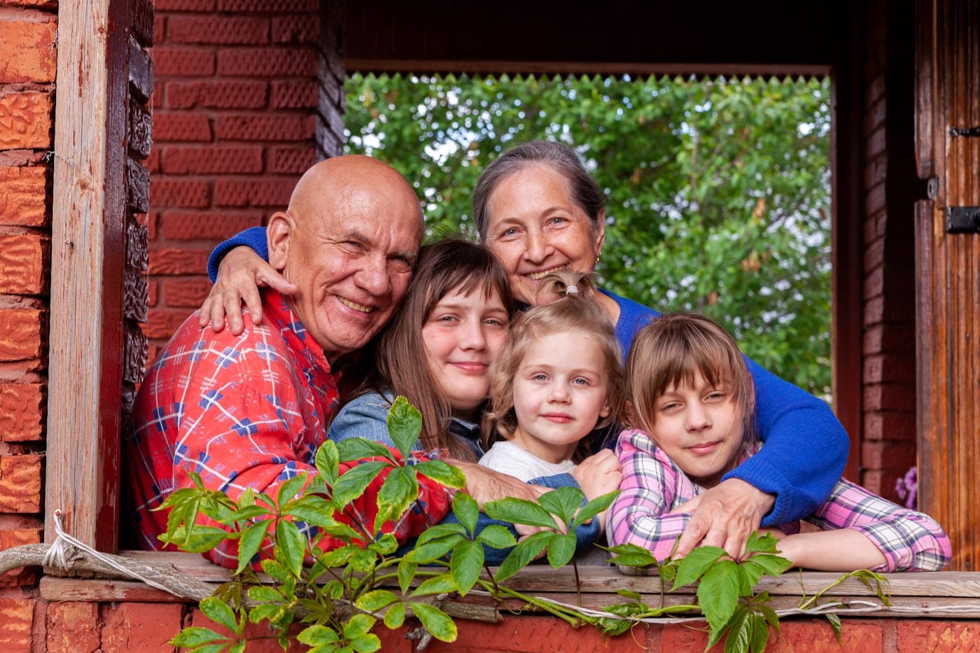 Grandparents surrounded by their grandchildren
