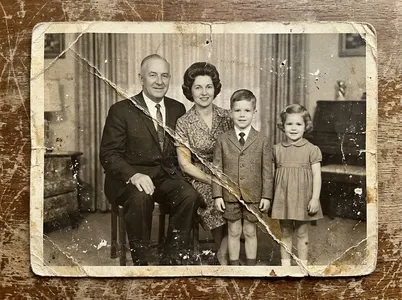 Example of an old, damaged family photo, before restoration