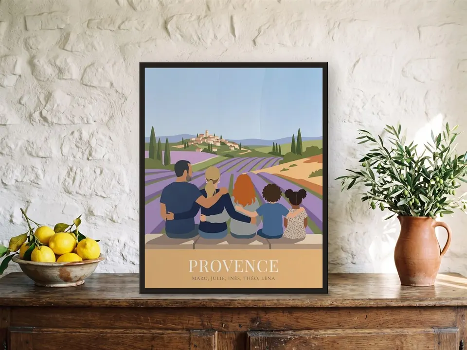 Family-from-behind poster, “Provence”, in a black frame on an oak farmhouse sideboard against a whitewashed stone wall, beside a bowl of lemons and an olive branch in a pitcher