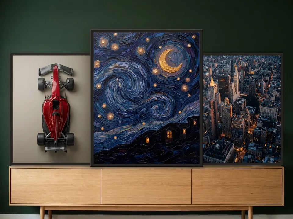 Three prints, “Single-seater”, “Starry night” and “City by night”, in black frames, standing side by side on a long light oak sideboard against a bottle-green wall